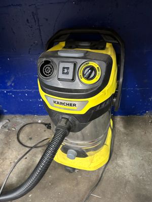 a yellow and black vacuum on the floor