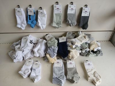 many pairs of socks that are on display in a store