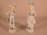 pair of blue and white porcelain figurines of a man and a woman