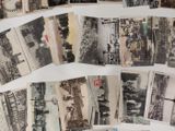 many old black and white photos on a table