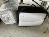 two bags of bedding on the ground next to each other