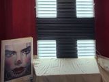 a picture of a red room with a cross on the wall