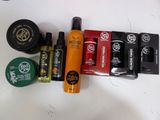 many different types of hair products sitting on a table