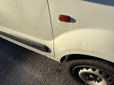an image of a white truck parked on the side of the road