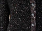 a close up of a black cardigan sweater on a mannequin mannequin mannequin mannequin mannequin mannequin mann