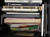 many books stacked on top of each other on a shelf