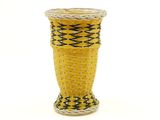 a yellow vase with a black and white design on it