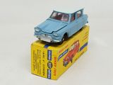 a blue toy car sitting on top of a yellow box