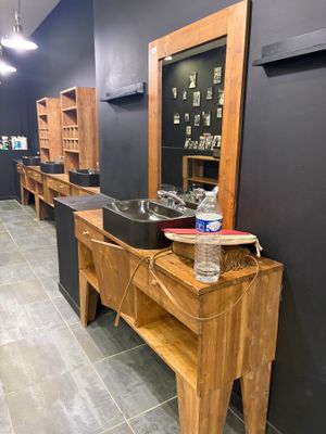 a photo of a bathroom with a sink and a mirror