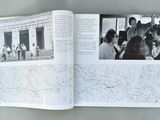 an open book with a picture of a group of people on it
