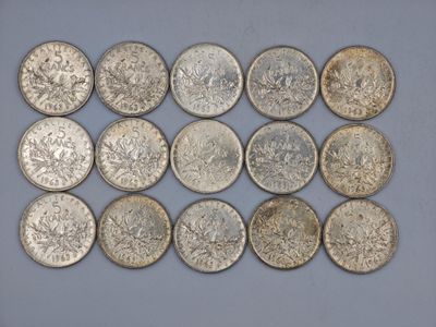 a close up of a bunch of silver coins on a table