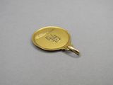 an image of a gold coin with a chinese writing on it