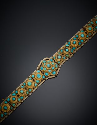 un bracelet en or et turquoise, orné de pierres de turquoise