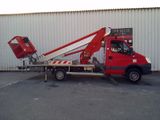 a red truck that is parked in front of a building