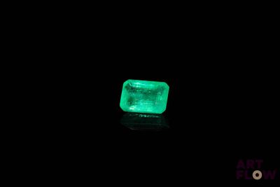 a green emerald in the dark