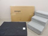 a box and a mattress on the floor next to a box