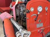 a red fire hydrant sitting inside of a building