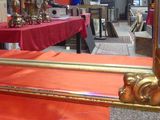 a mirror that is sitting on a table in a room