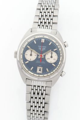 an image of a close up of a wrist watch on a white surface