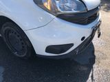 a white car that is parked in the parking lot