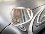 a close up of a car ' s rear view mirror