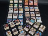a bunch of cards are sitting on a table with a black background
