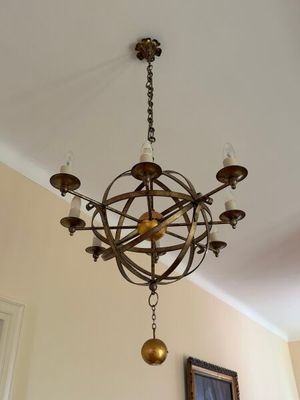 a chandelier hanging from the ceiling in a living room