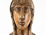 statue of a woman wearing a headdress and a crown