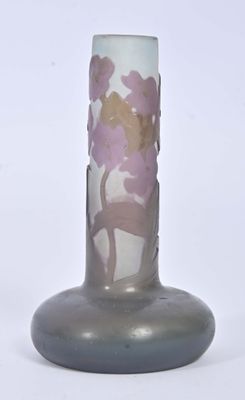 a glass vase with a flower design on it