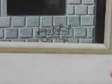 a painting on the wall of a building that has graffiti on it