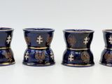 four shot glasses sitting next to each other on a table