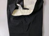 the pants are black and have a white lining on them