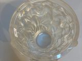 a glass bowl that is sitting on a table