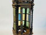 a small lantern hanging from the ceiling of a room