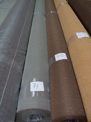 a lot of different colors of fabric on the floor