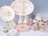 many different types of dishes and cups on the table