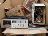 a pile of boxes with electronic equipment inside of it