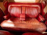 a red leather seat in the back of a car