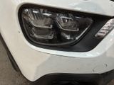 a close up of a car ' s headlight and front bumper