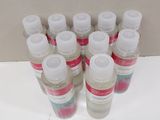 several bottles of hand sanitizer sitting on a counter top