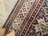 a person standing on a rug with their feet on the floor