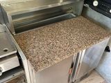 stainless steel outdoor kitchen with granite counter top and stainless steel oven