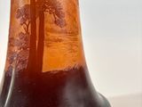 a vase that has a picture of a tree on it