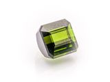 a green tourmaline stone on a white background