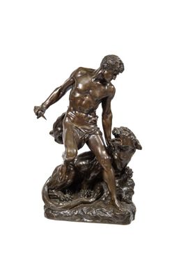 statue en bronze représentant un homme avec un chien sur un rocher