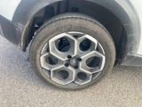 a close up of a car ' s tire on the street