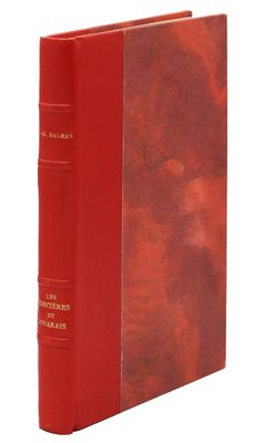 a red book with a red cover and gold lettering on it