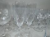 many empty wine glasses sitting on a table