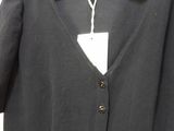 the back of a black cardigan sweater with buttons on a hanger