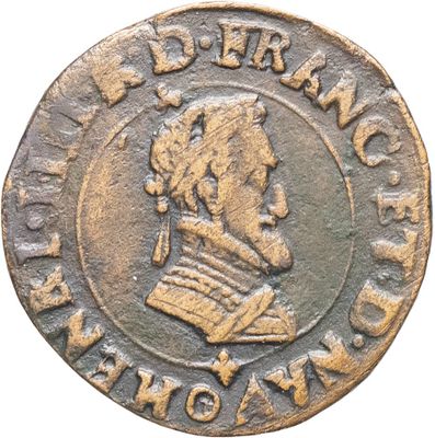 Gros plan sur une pièce de monnaie portant le visage d'un homme